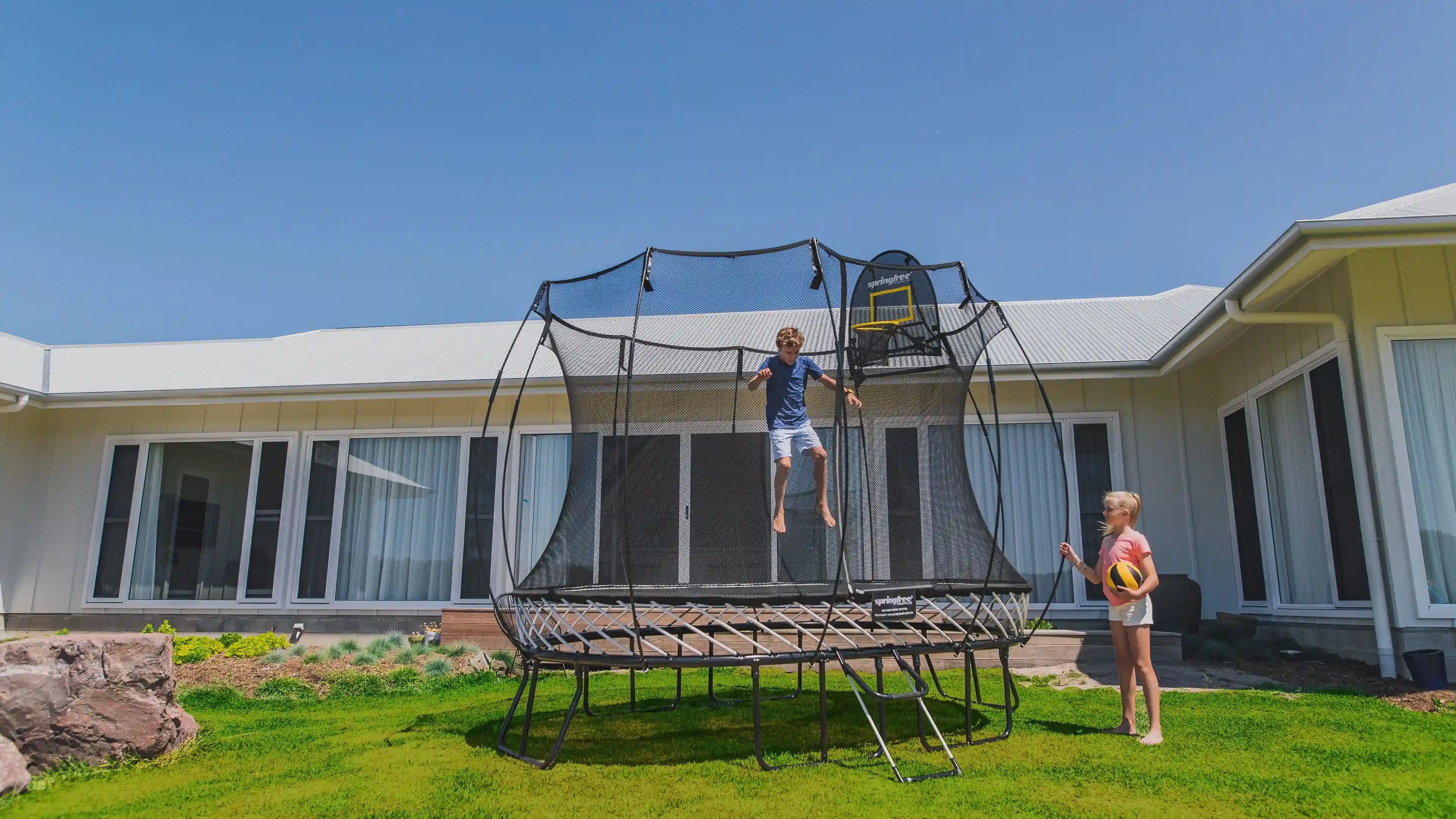 boy jumping on a trampoline