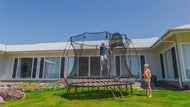 Load image into Gallery viewer, boy jumping on a trampoline