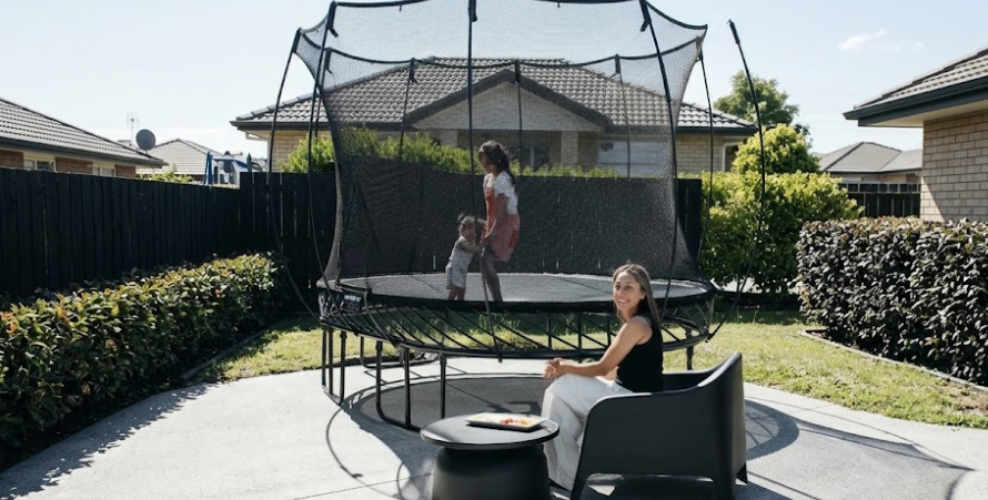 How to Hide a Trampoline in Your Backyard: Hedging, Fencing, and Placement Strategies