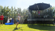 Load image into Gallery viewer, kids playing around a trampoline with a sun shade
