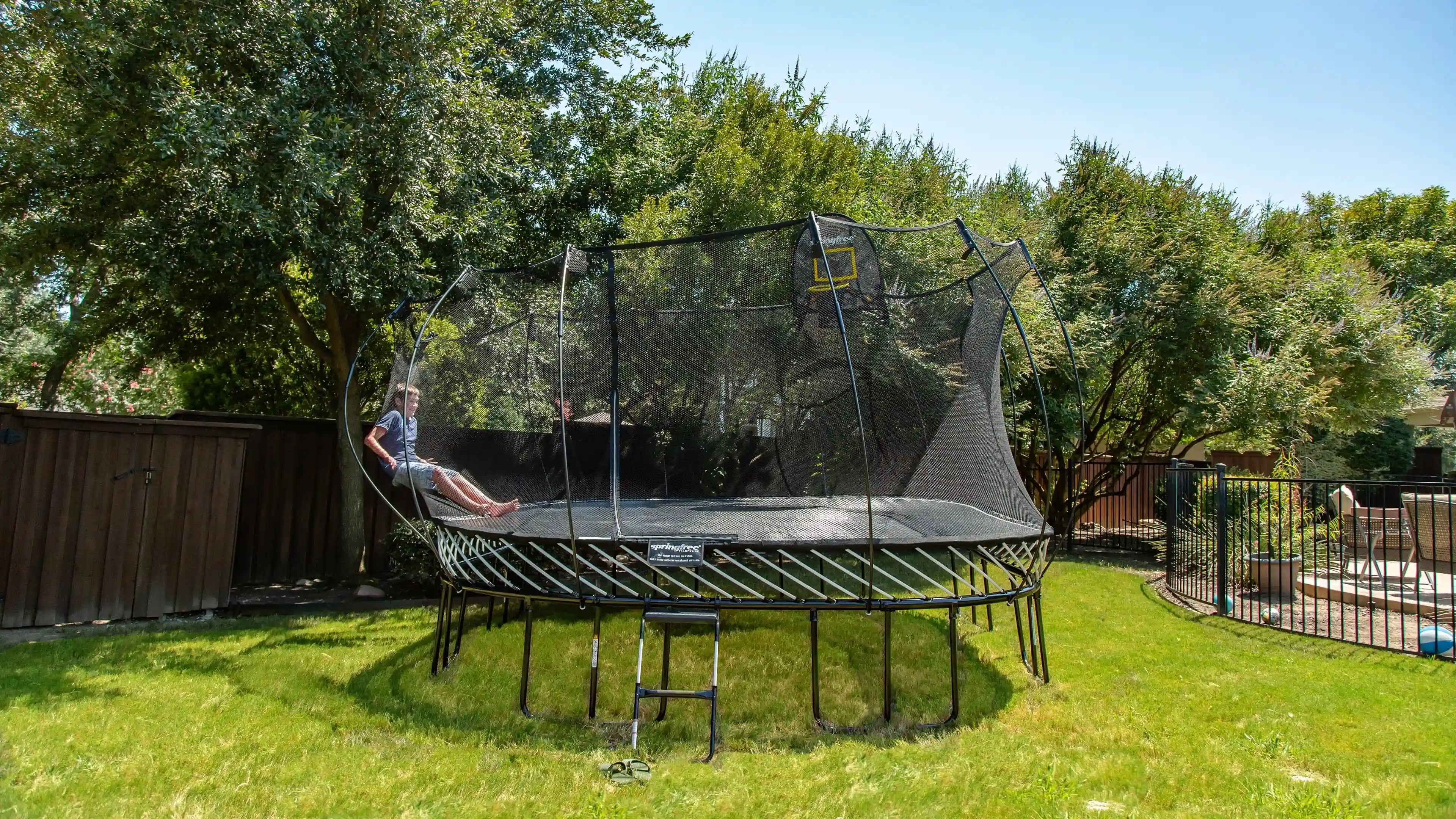 boy bouncing off a flexinet