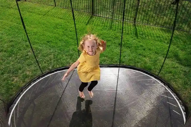 girl jumping on a trampoline