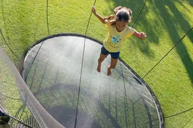 girl jumping on a trampoline