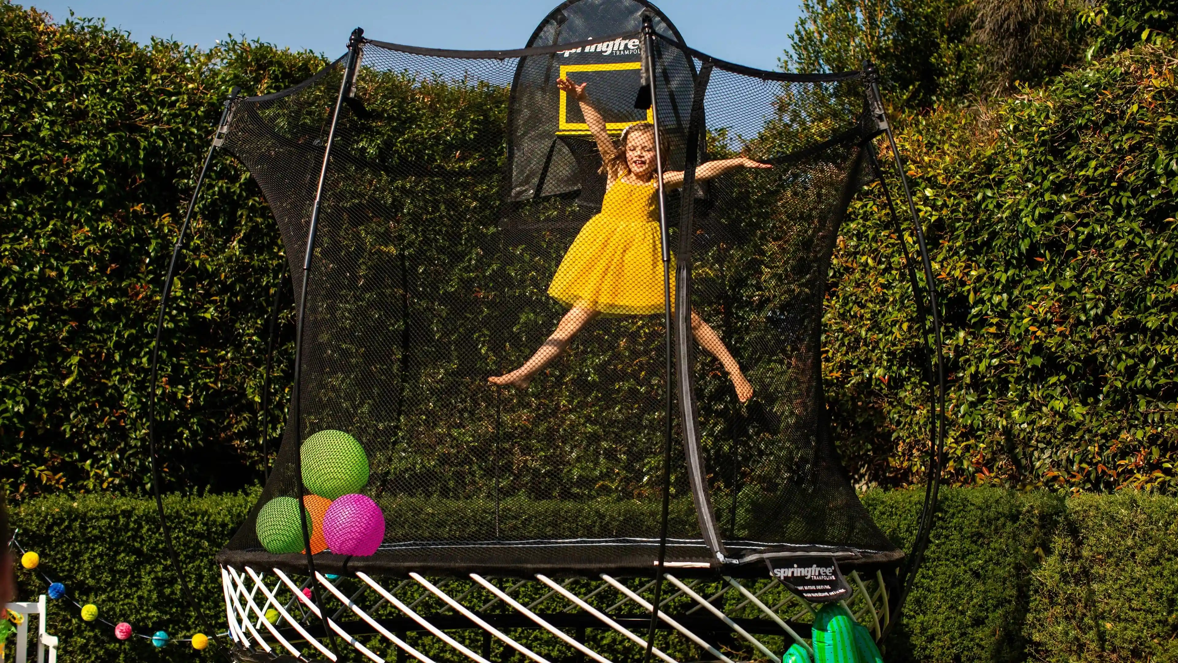 girl jumping high on a trampoline