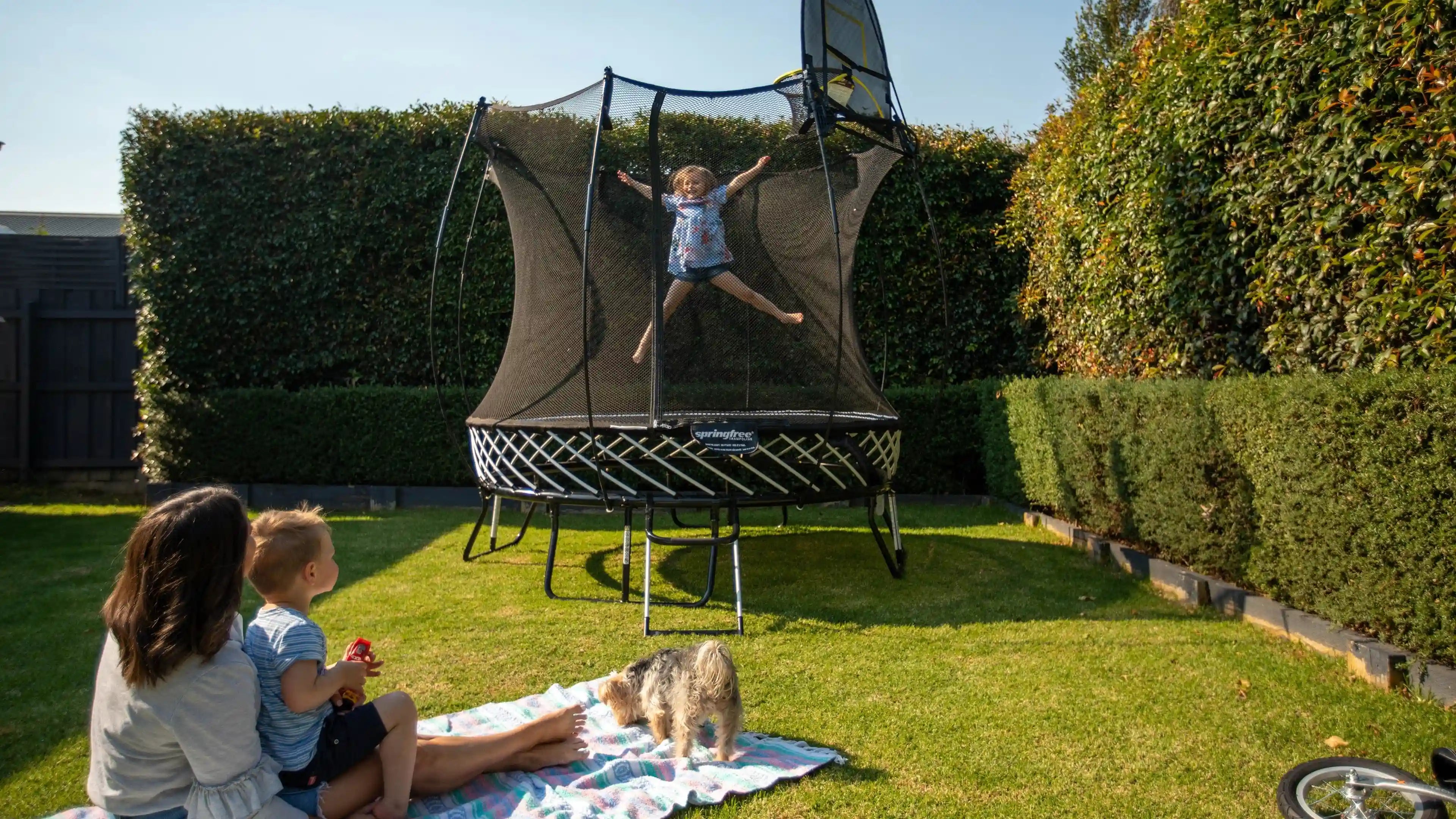 girl enjoys jumping on a trampoline