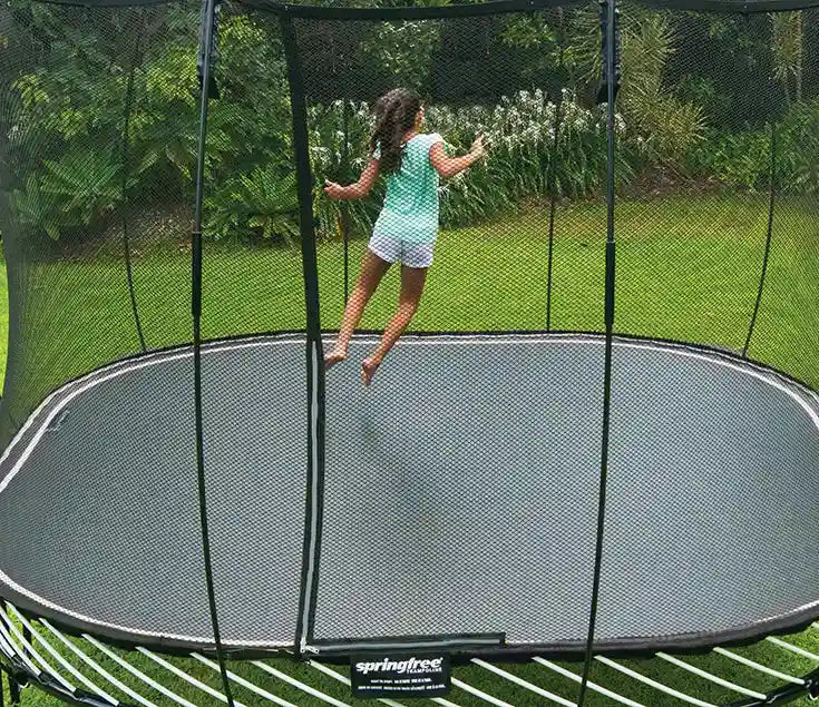 girl jumping on a trampoline