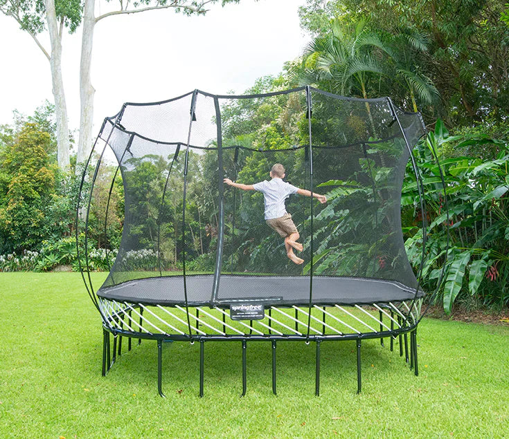 boy jumping on a trampoline